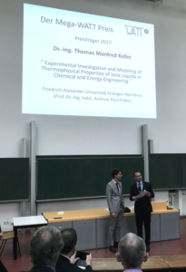 Photo how Thomas Koller is handed over the Mega-WATT Award certificate from Burak Atakan