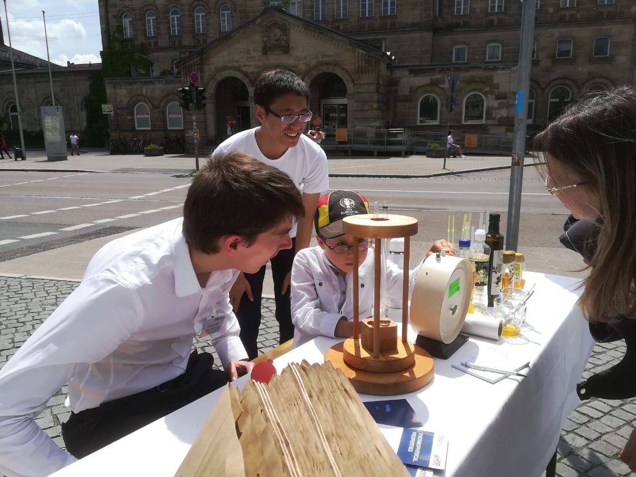Thomas Koller and Shaomin Yan advising a young scientist for his first viscosity measurement