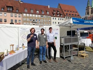 photo of Michael Rausch, Pouria Zangi and Manuel Kerscher representing AOT-TP at the Market Days of Knowledge
