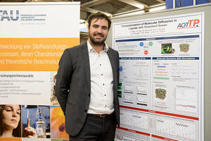 photo of Cédric Giraudet in front of the poster he presented at the Day of the Faculty of Engineering of FAU