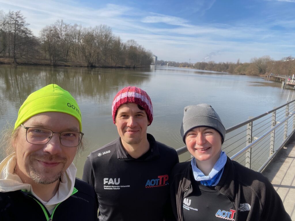 Photo showing Michael Rausch, Tobias Klein and Frances Lenahan before the FinishLine Run 2025 in Nuremberg.