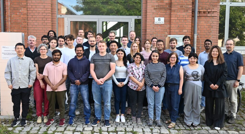 photograph showing all members of AOT-TP in front of the institute entrance in July 2025