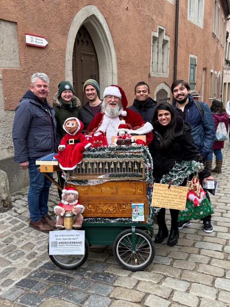 members of AOT-TP with Santa Clause behind a street organ in Rothenberg ob der Tauber